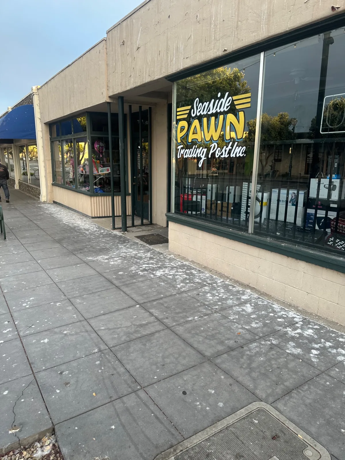 Commercial storefront sidewalk before cleaning